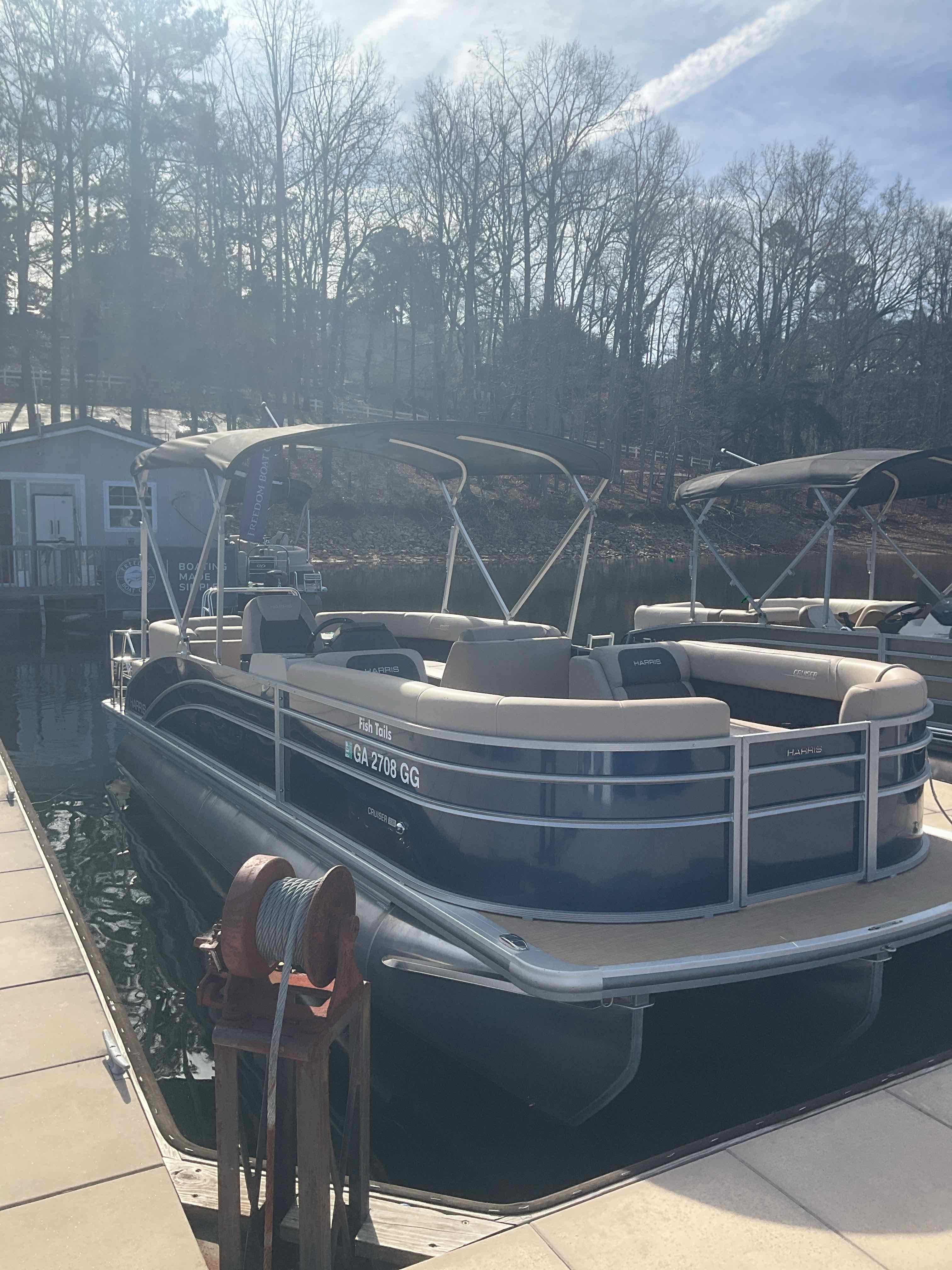 FISH TAILS (23' Harris Tri-toon 150 HP - Fishing/Cruising)